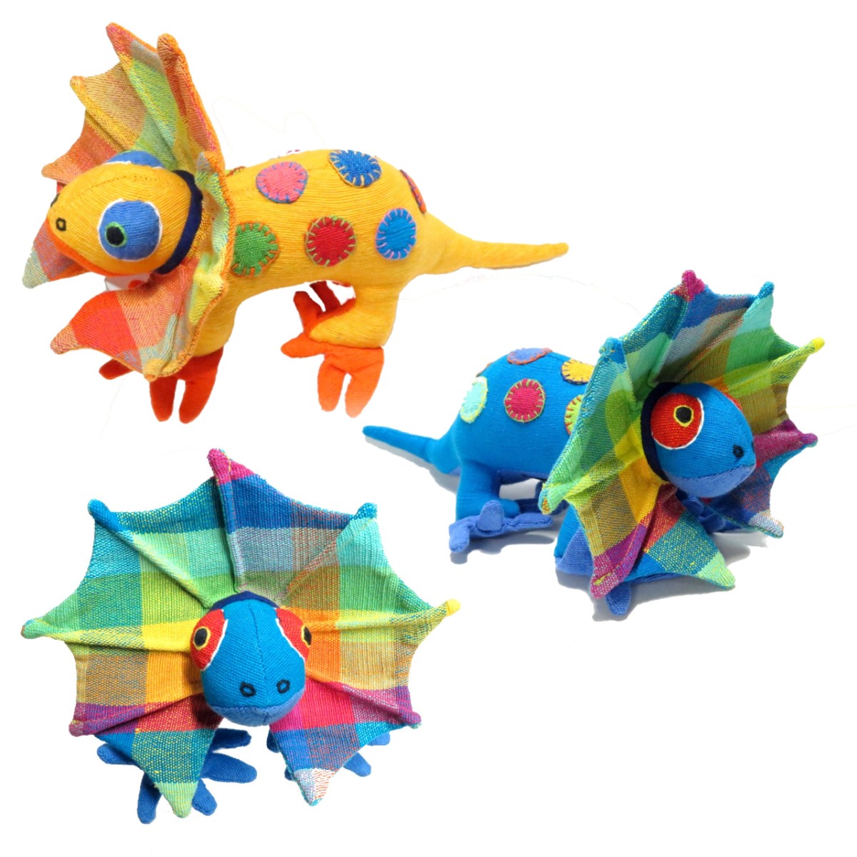 a group of three brightly coloured frill neck lizard soft toys.