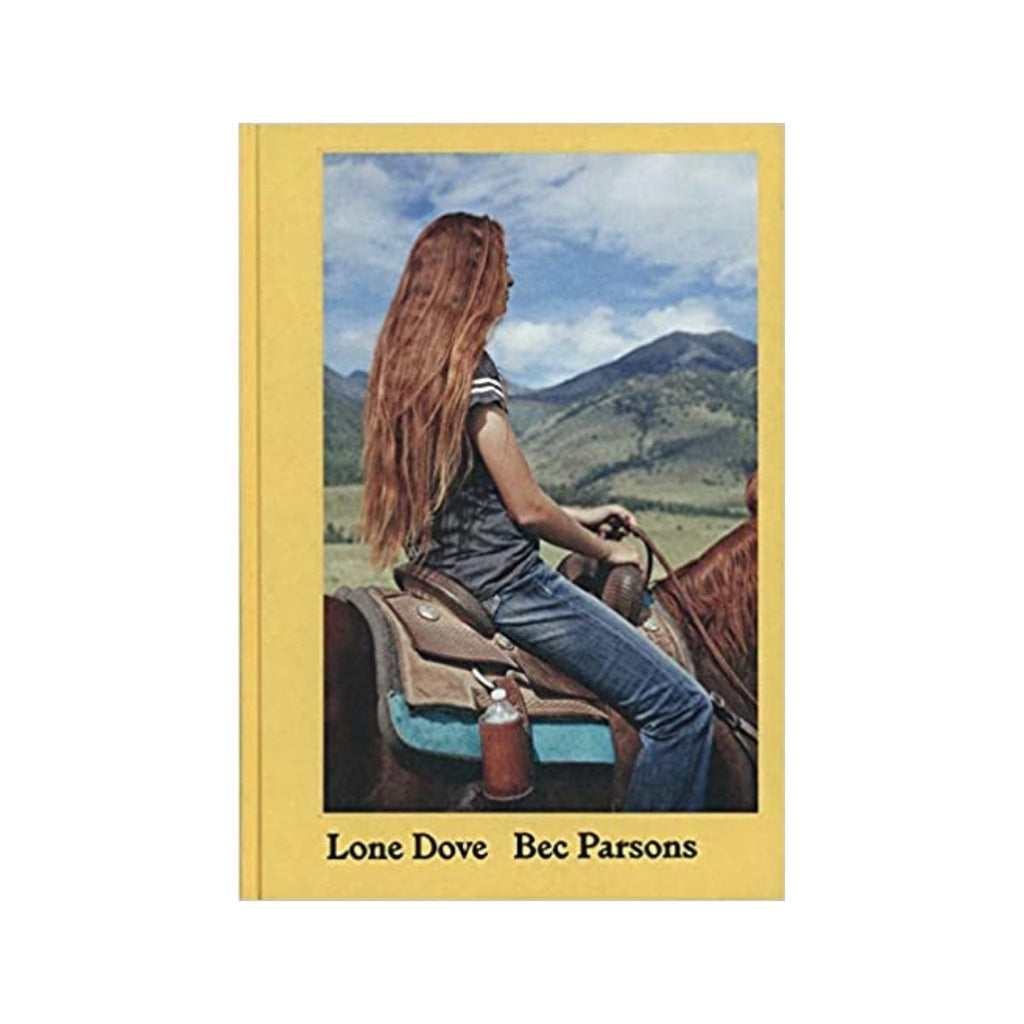 Book cover featuring a yellow background including a centered photograph of a woman with light brown hair  sitting on top of a horse with a landscape in the background