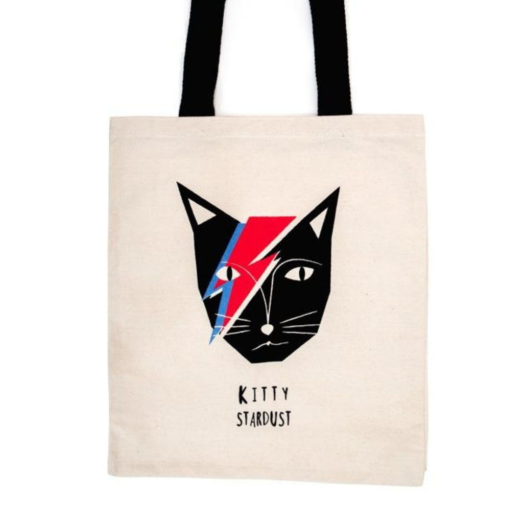 Image featuring a tote bag in the centre with a graphically illustrated David Bowie as a cat featuring his iconic character Ziggy Stardust