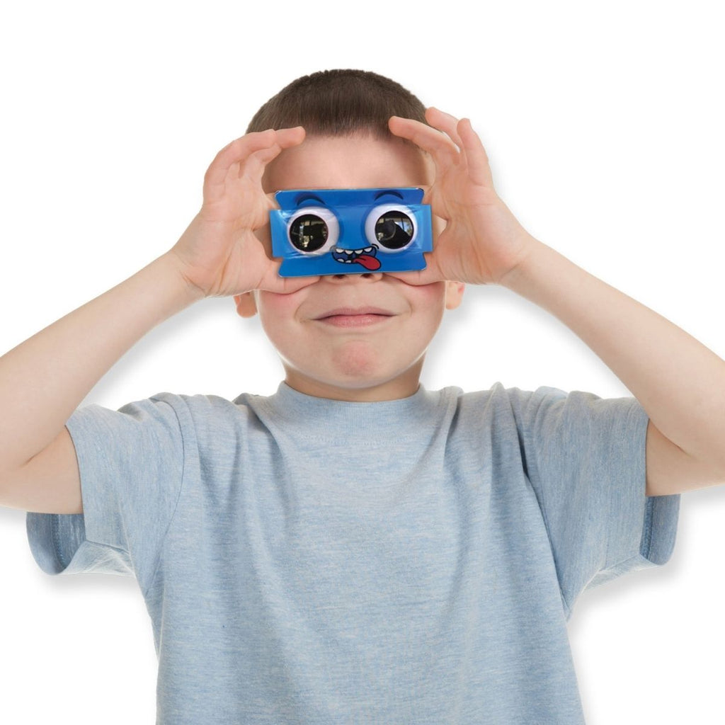 image of an individual holding up the monster binoculars to his eyes